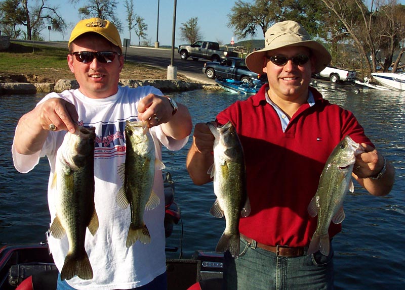 Two anglers with largemouth bass on a spring Lake Travis guide trip, March 2005