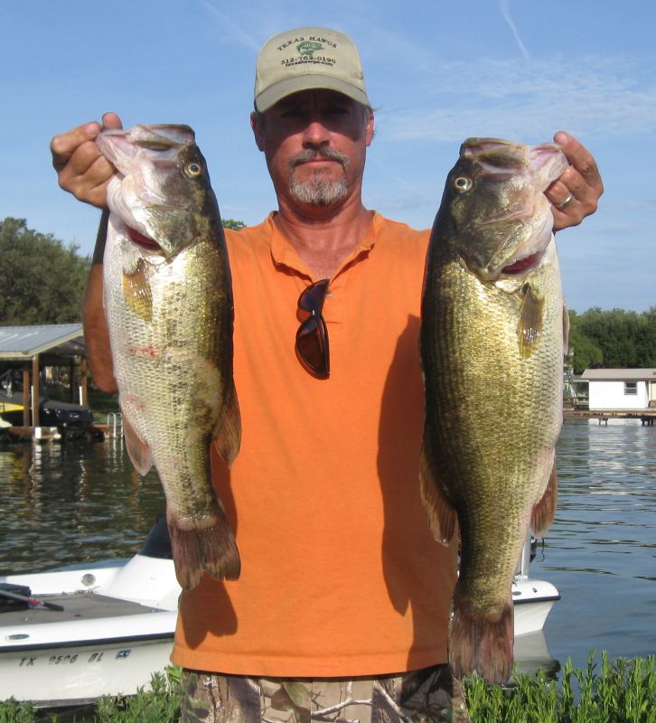 Angler with two largemouth bass at a Lake LBJ club tournament, August 2011