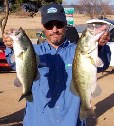 Angler with two winter largemouth bass from Lake Buchanan, January 2006