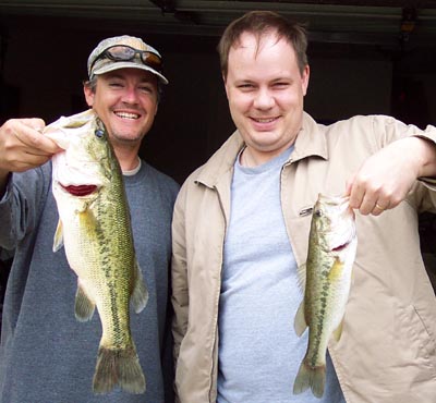 Two anglers with a pair of Lake Travis largemouth bass, April 2004