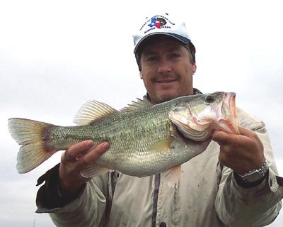 Guide Bryan Cotter with a fat winter largemouth bass from Lake Travis, January 2005
